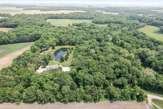 a view of a green yard with an outdoor seating