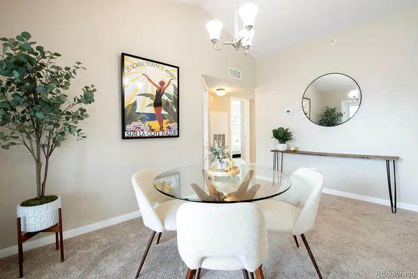 a dining room with furniture and window