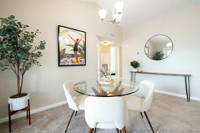 a dining room with furniture and window