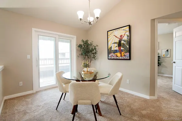 a dining room with furniture and window