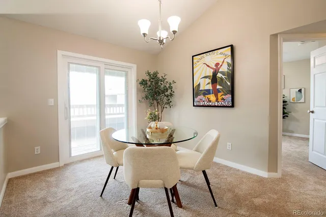 a dining room with furniture and window