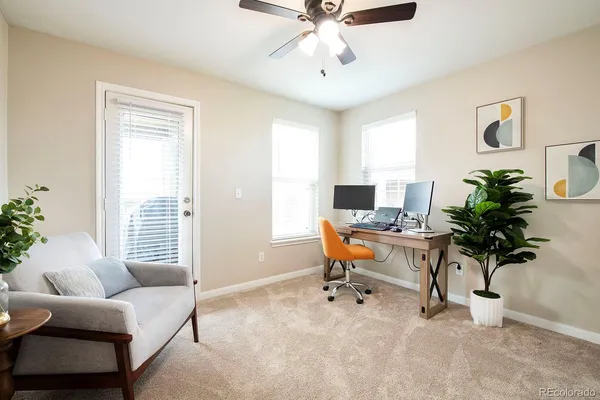 a workspace with furniture and a window