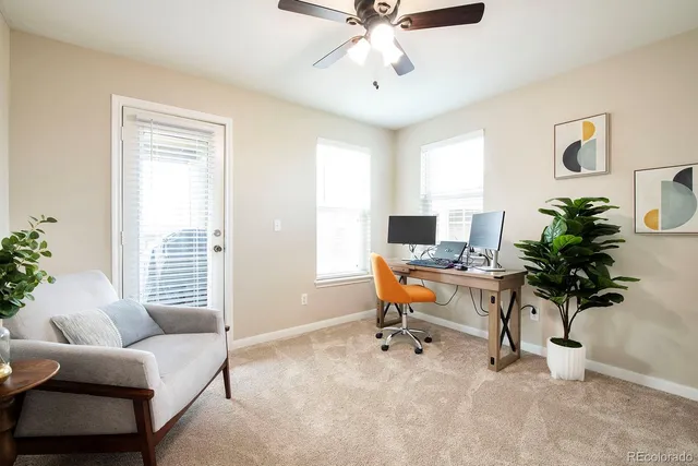 a workspace with furniture and a window