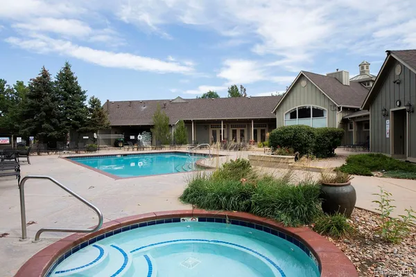 a aerial view of a house with swimming pool and furniture