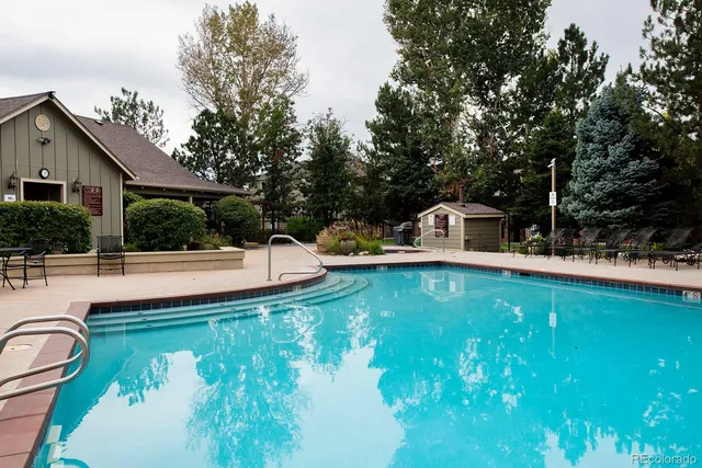 a view of a swimming pool with a patio