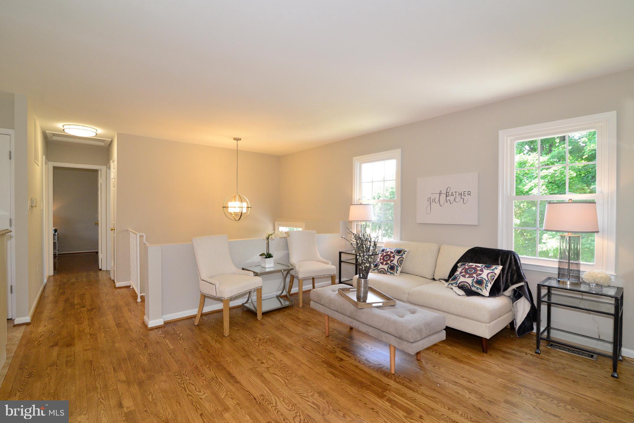 1515 Coat Ridge Road Herndon, VA 20170 - Photo 2 of 30 New Wood Flooring in Sunny Living Room.