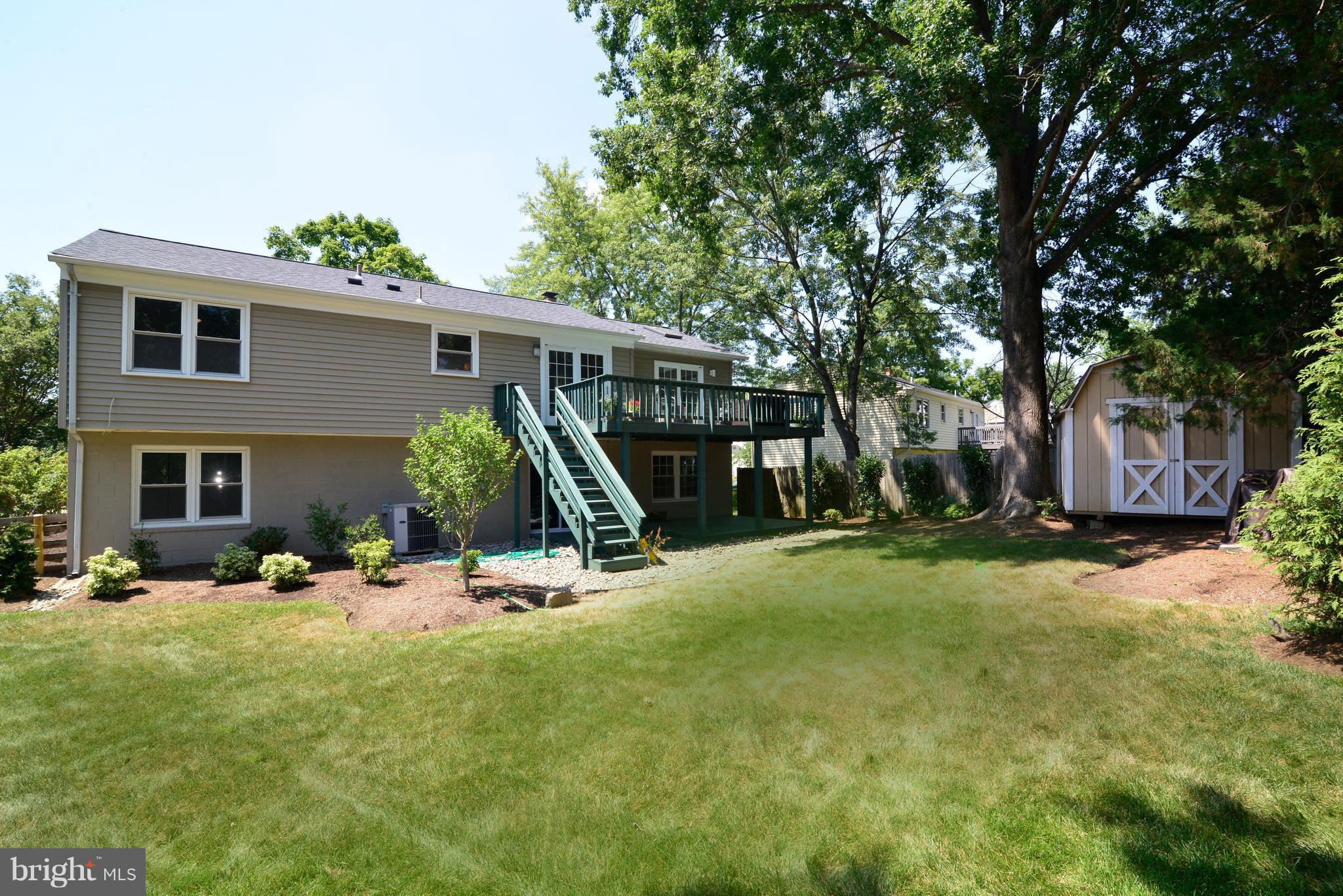1515 Coat Ridge Road Herndon, VA 20170 - Photo 23 of 30 View of Backyard, Professional Landscaping, Deck.