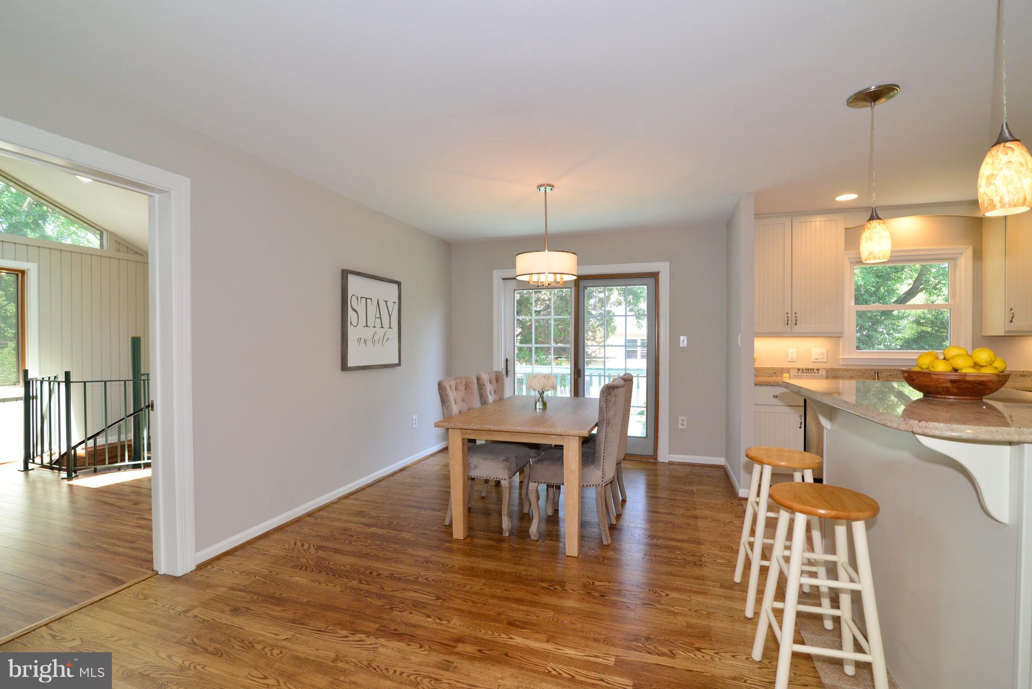 1515 Coat Ridge Road Herndon, VA 20170 - Photo 6 of 30 Dining Room with Sliding Glass Doors Open to Deck.