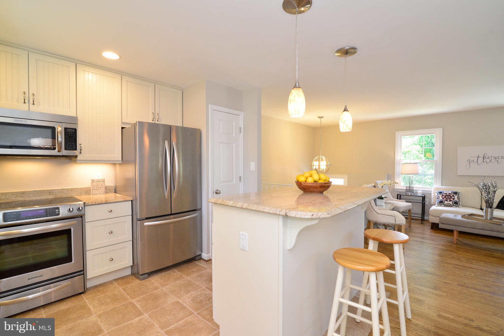 1515 Coat Ridge Road Herndon, VA 20170 - Photo 9 of 30 Open Concept Kitchen Breakfast Bar.