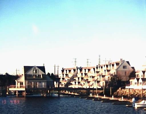 516 Popes Island Road, Unit 516 Milford, CT 06461 - Photo 1 of 1 a view of houses with a street