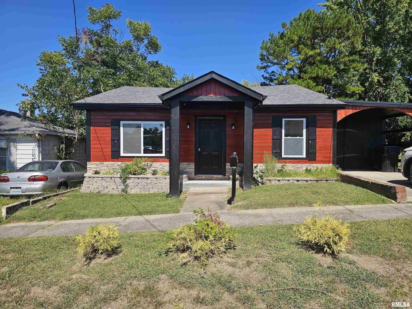 a front view of a house with garden