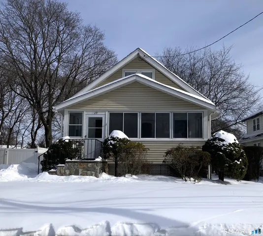 a front view of house with a yard