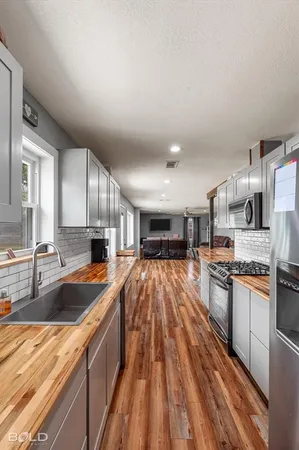 a view of entryway with wooden floor and stairs
