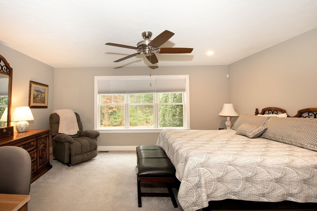 18 Kevin's Way, Unit 18 Scituate, MA 02066 - Photo 12 of 33 a bedroom with a bed and glass window