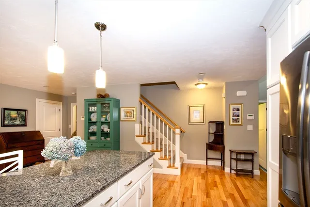 a view of a livingroom with furniture hardwood floor and staircase
