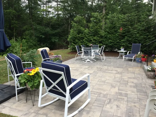 a patio with table and chairs