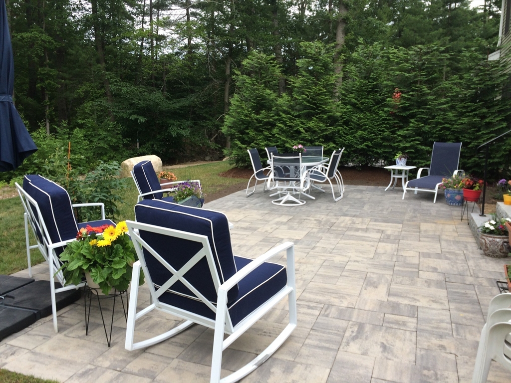 18 Kevin's Way, Unit 18 Scituate, MA 02066 - Photo 29 of 33 a patio with table and chairs