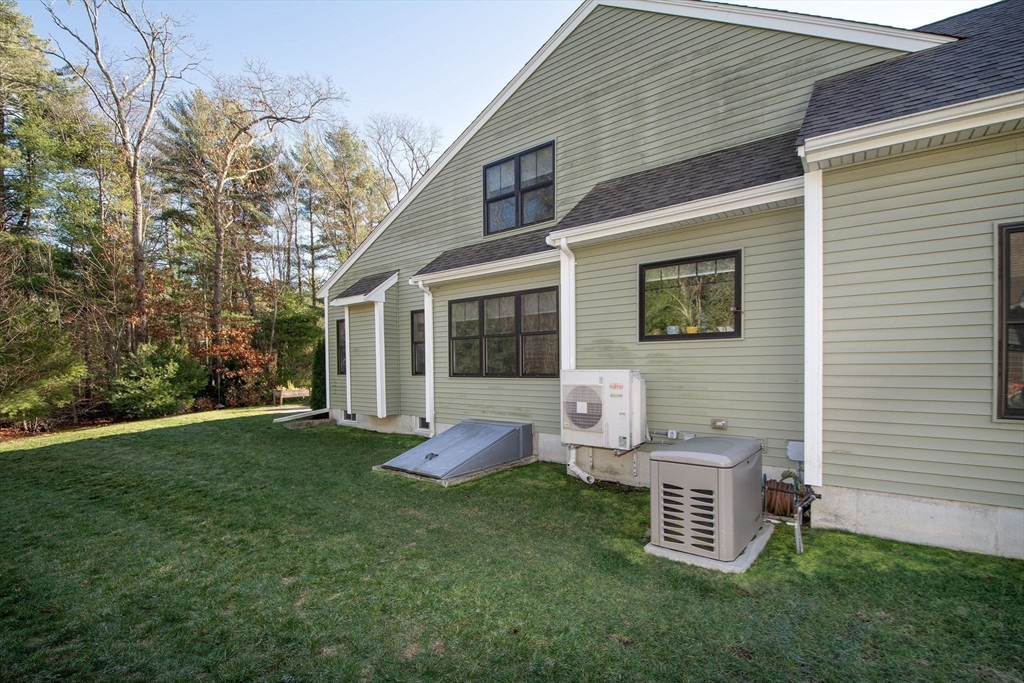 18 Kevin's Way, Unit 18 Scituate, MA 02066 - Photo 31 of 33 a view of a house with backyard