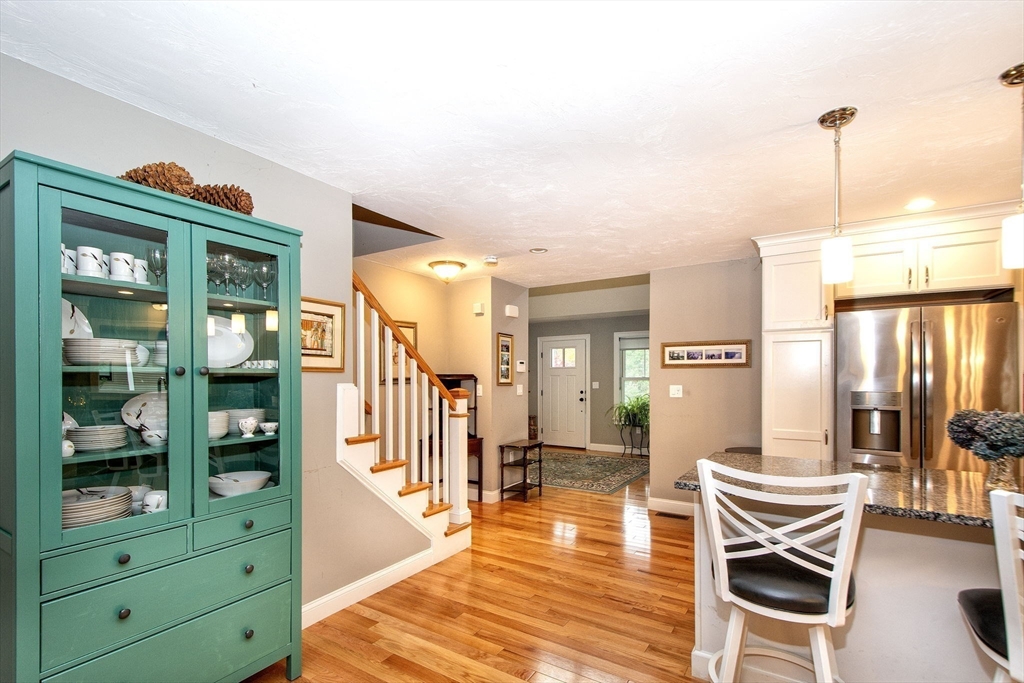 18 Kevin's Way, Unit 18 Scituate, MA 02066 - Photo 6 of 33 a living room with furniture a wooden floor and next to a window