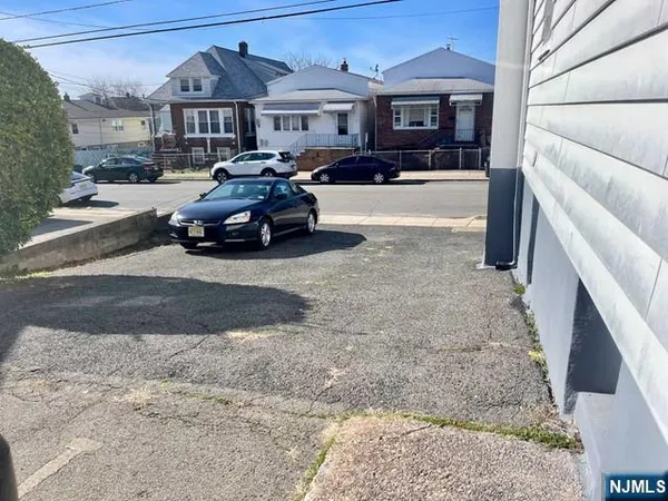 a view of a car parked in front of a house
