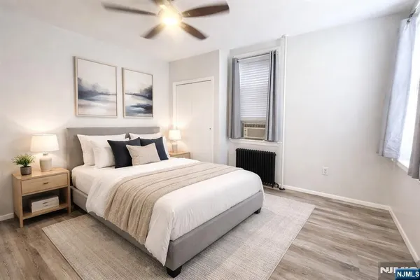 a bedroom with a bed and window