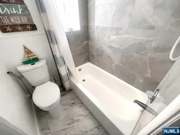 a bathroom with a sink and toilet
