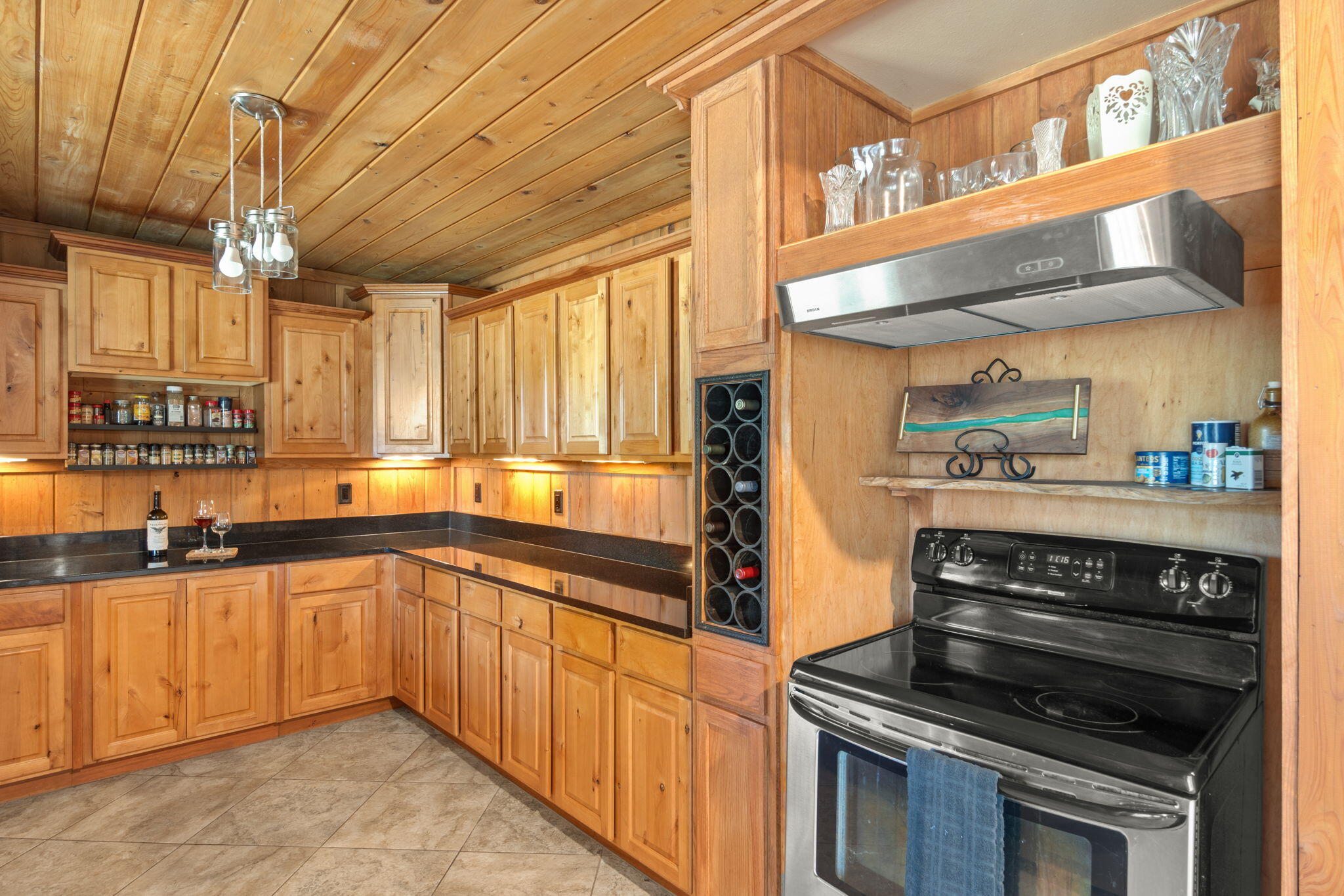 3350 New Ebenezer Road Laurel Hill, FL 32567 - Photo 14 of 53 a kitchen with stainless steel appliances a stove sink and cabinets