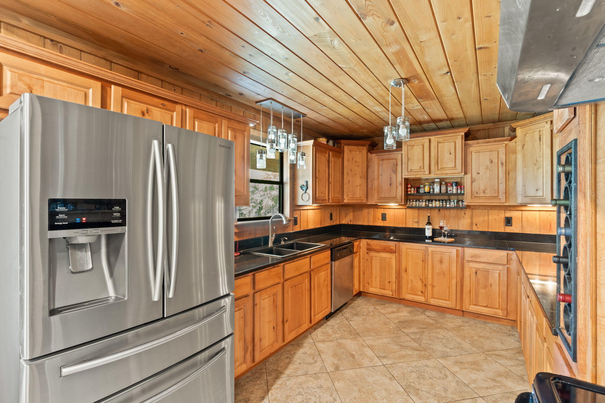 3350 New Ebenezer Road Laurel Hill, FL 32567 - Photo 15 of 53 a kitchen with stainless steel appliances granite countertop a refrigerator a sink dishwasher a stove and white countertops with wooden floor