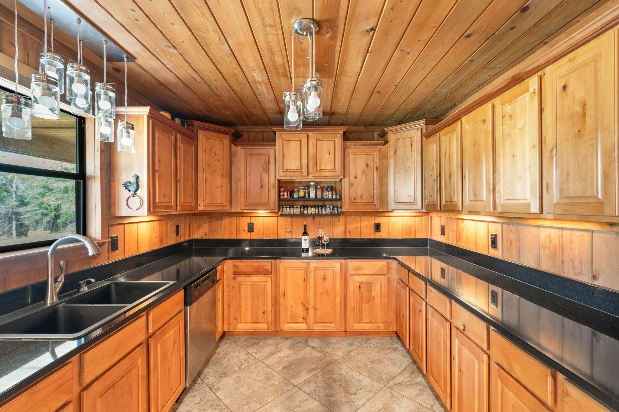 3350 New Ebenezer Road Laurel Hill, FL 32567 - Photo 16 of 53 a kitchen with stainless steel appliances granite countertop sink stove and large window