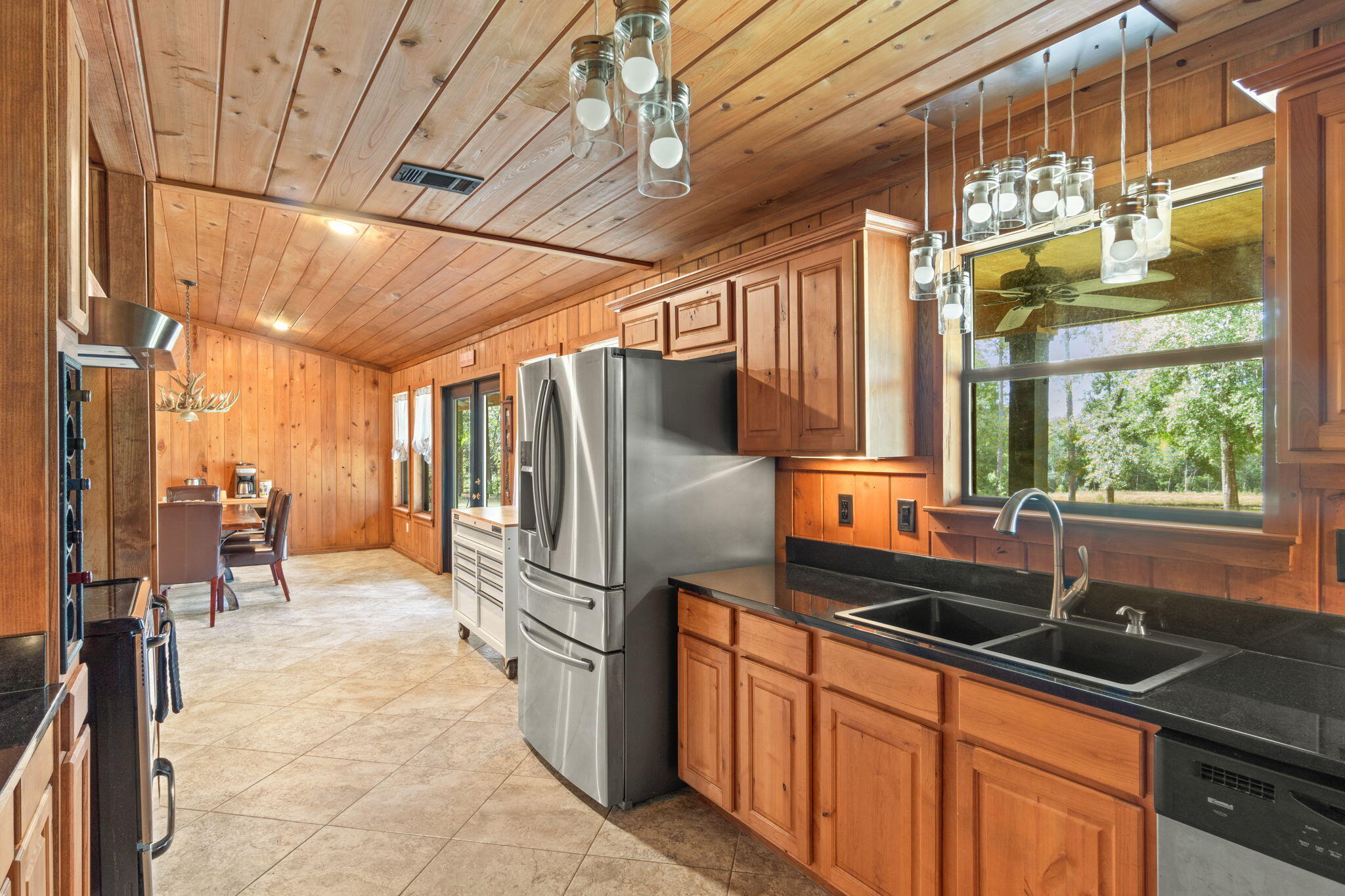 3350 New Ebenezer Road Laurel Hill, FL 32567 - Photo 17 of 53 a kitchen with stainless steel appliances a sink and cabinets