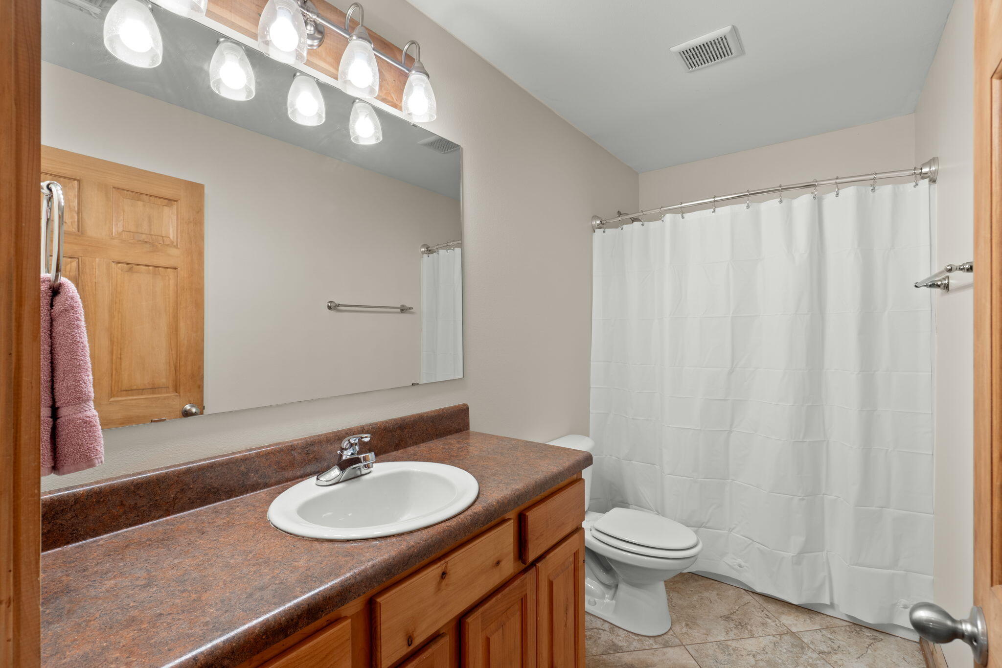 3350 New Ebenezer Road Laurel Hill, FL 32567 - Photo 20 of 53 a bathroom with a sink and a mirror