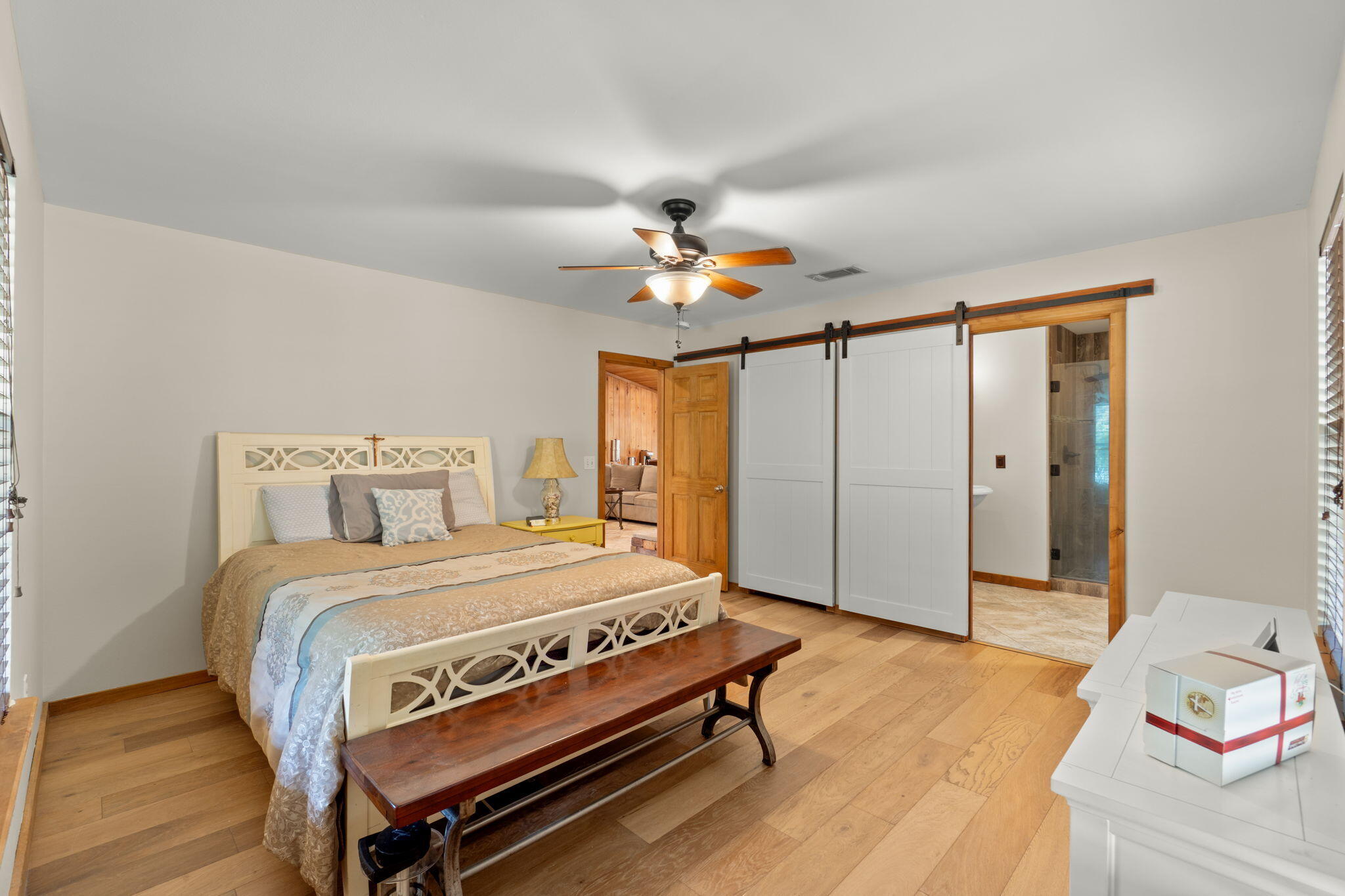 3350 New Ebenezer Road Laurel Hill, FL 32567 - Photo 24 of 53 a bedroom with a bed a dresser and a chandelier