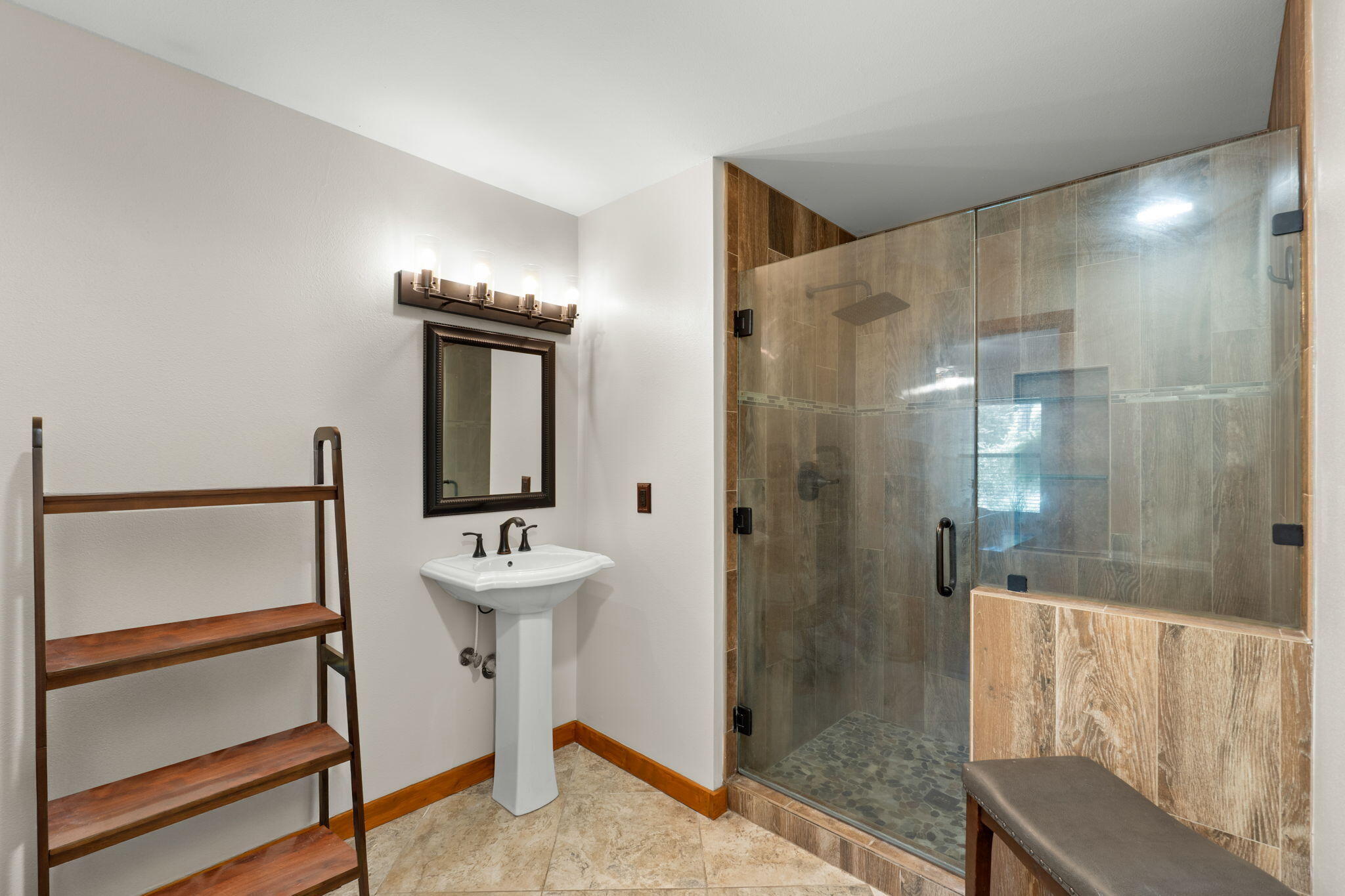 3350 New Ebenezer Road Laurel Hill, FL 32567 - Photo 25 of 53 a bathroom with a sink a mirror and a shower