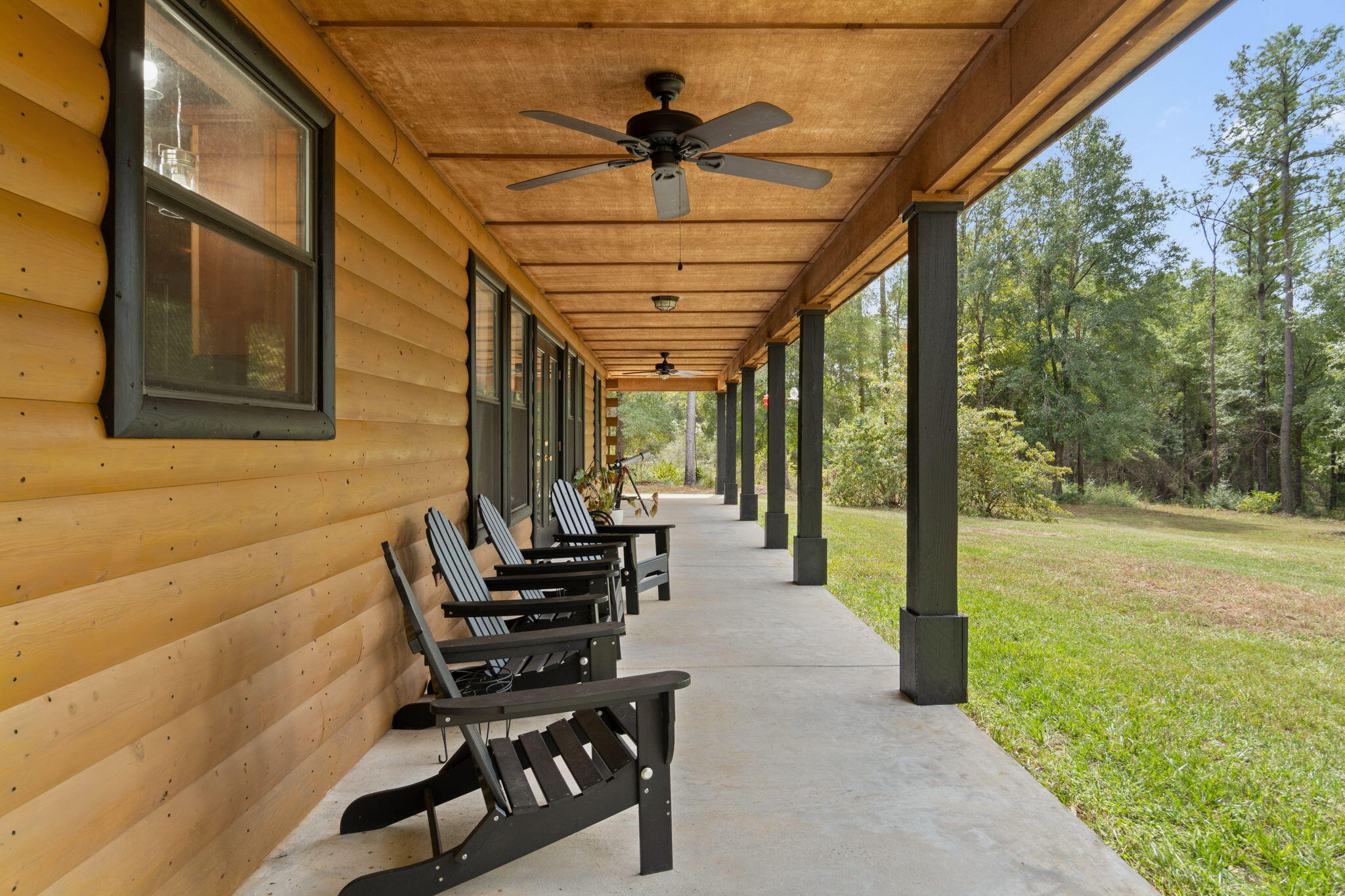 3350 New Ebenezer Road Laurel Hill, FL 32567 - Photo 27 of 53 a lobby with furniture and garden view