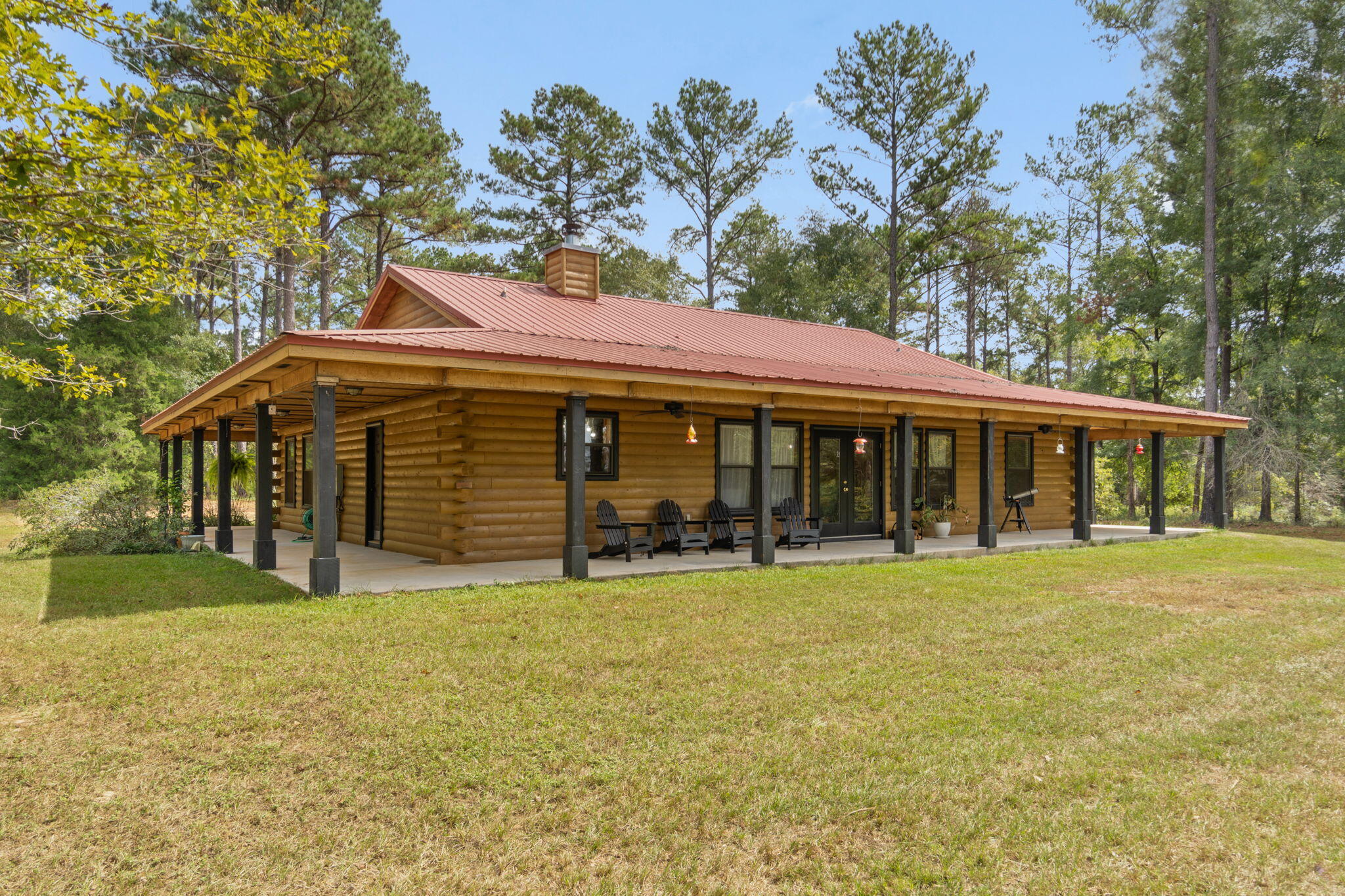 3350 New Ebenezer Road Laurel Hill, FL 32567 - Photo 29 of 53 a front view of a house with a garden