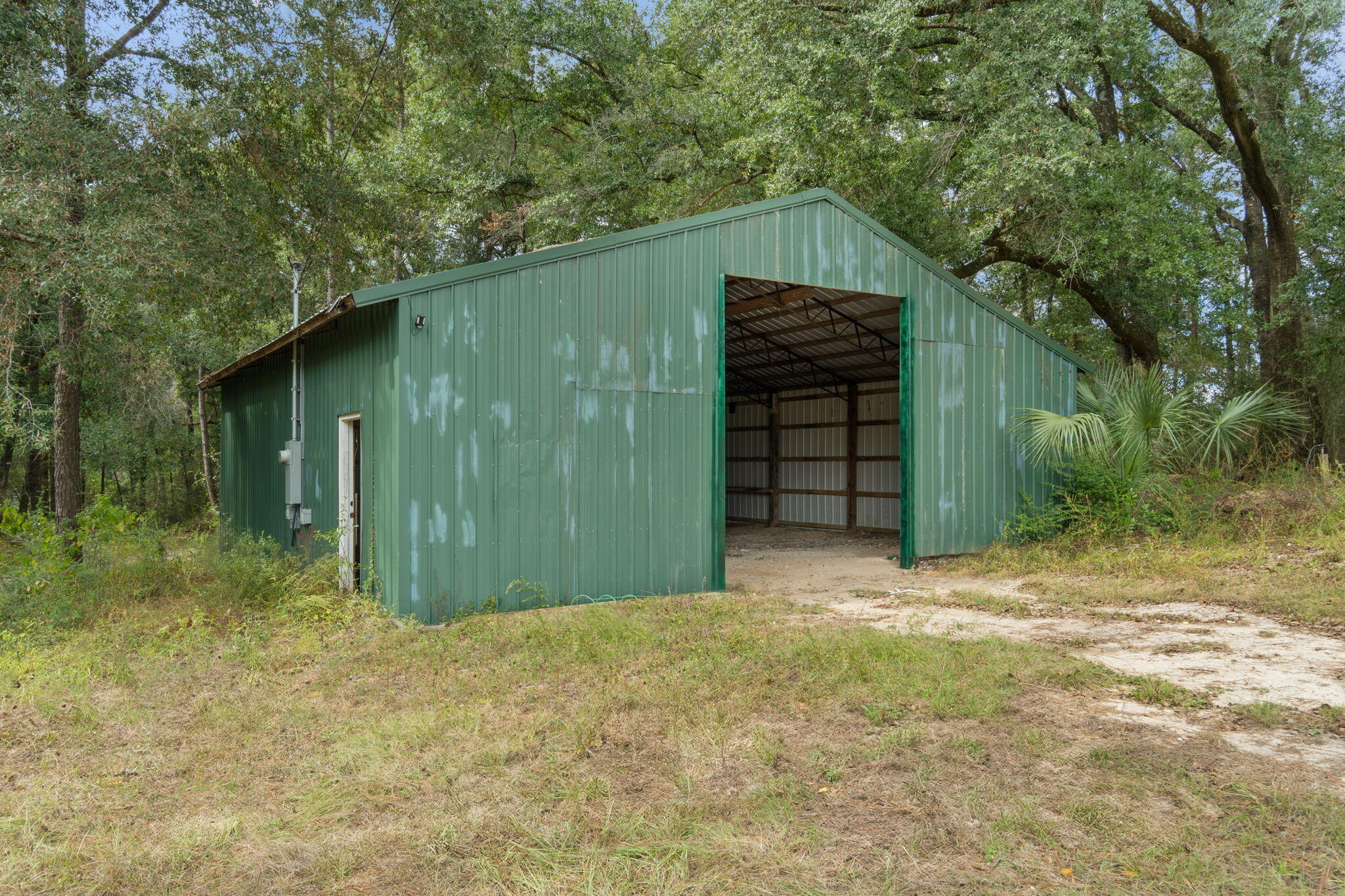 3350 New Ebenezer Road Laurel Hill, FL 32567 - Photo 36 of 53 a backyard of a house with lots of green space