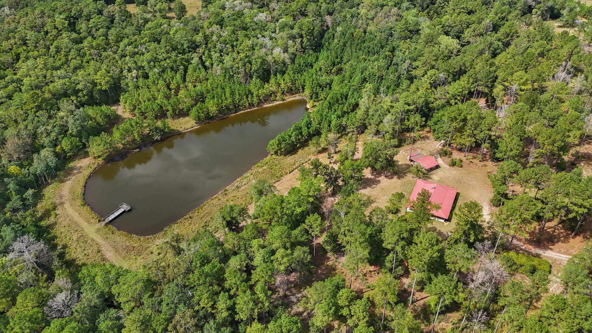 3350 New Ebenezer Road Laurel Hill, FL 32567 - Photo 46 of 53 an aerial view of residential house with outdoor space and trees around