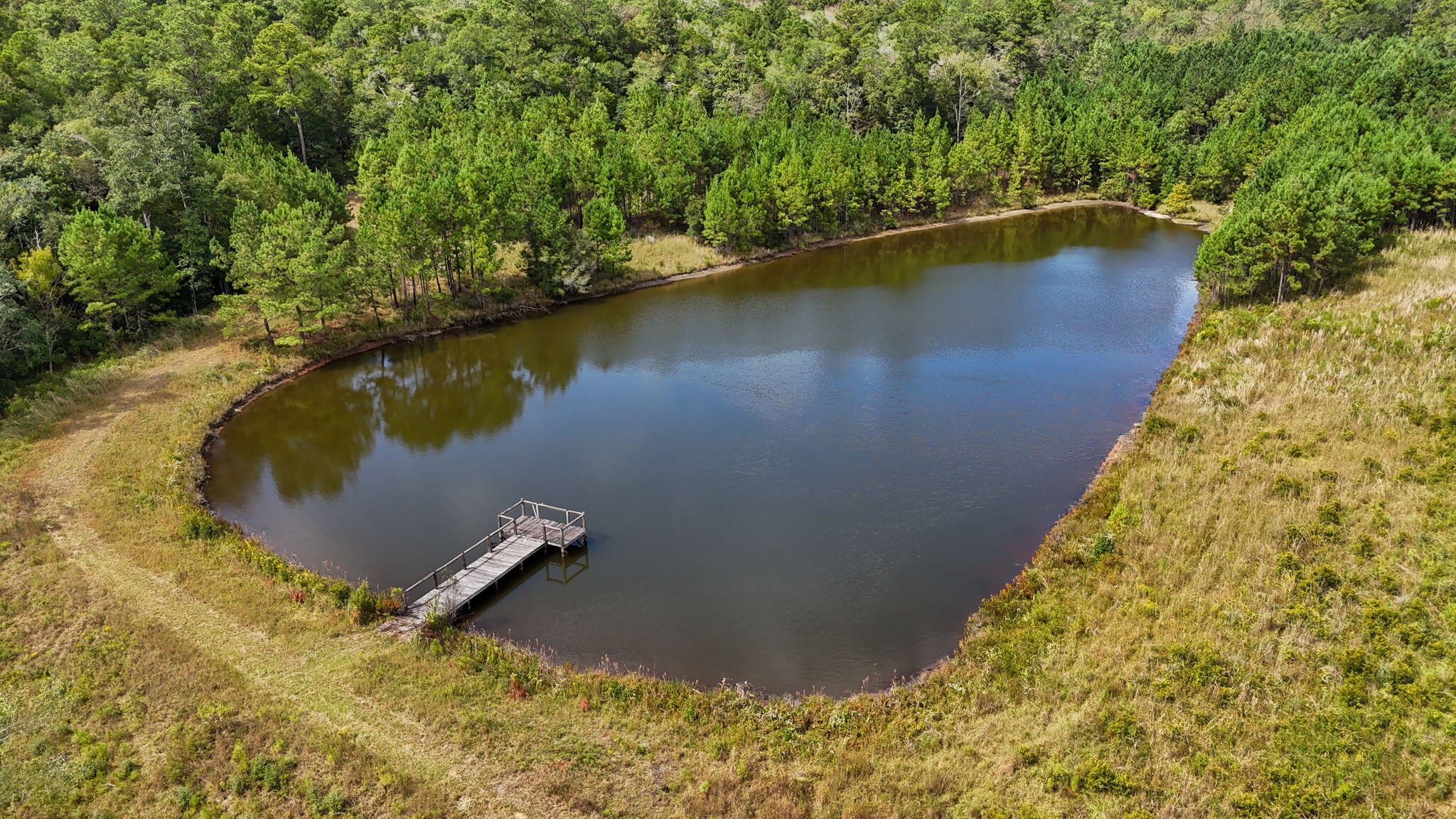 3350 New Ebenezer Road Laurel Hill, FL 32567 - Photo 49 of 53 a view of a lake with a outdoor space