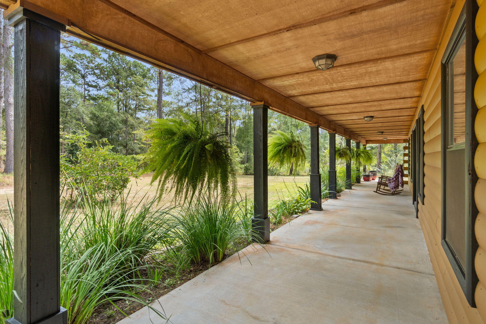 3350 New Ebenezer Road Laurel Hill, FL 32567 - Photo 5 of 53 a view of a porch with garden
