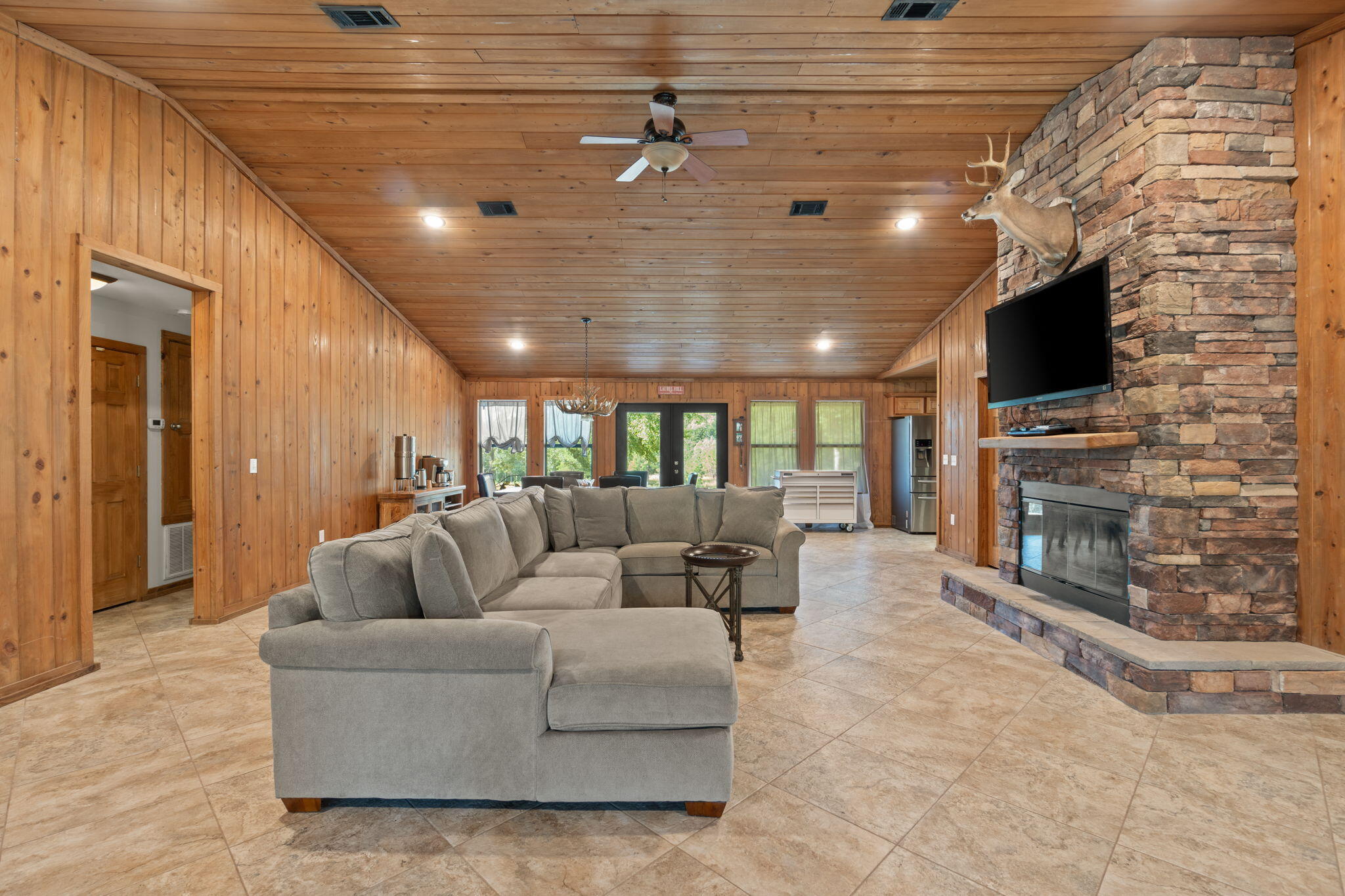 3350 New Ebenezer Road Laurel Hill, FL 32567 - Photo 9 of 53 a living room with fireplace furniture and a flat screen tv