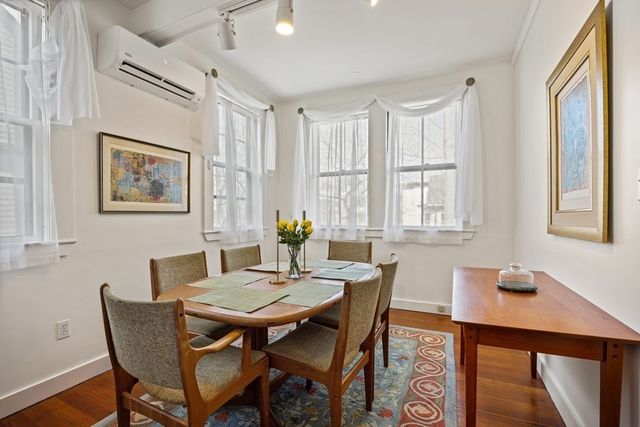 a view of a dining room with furniture and window