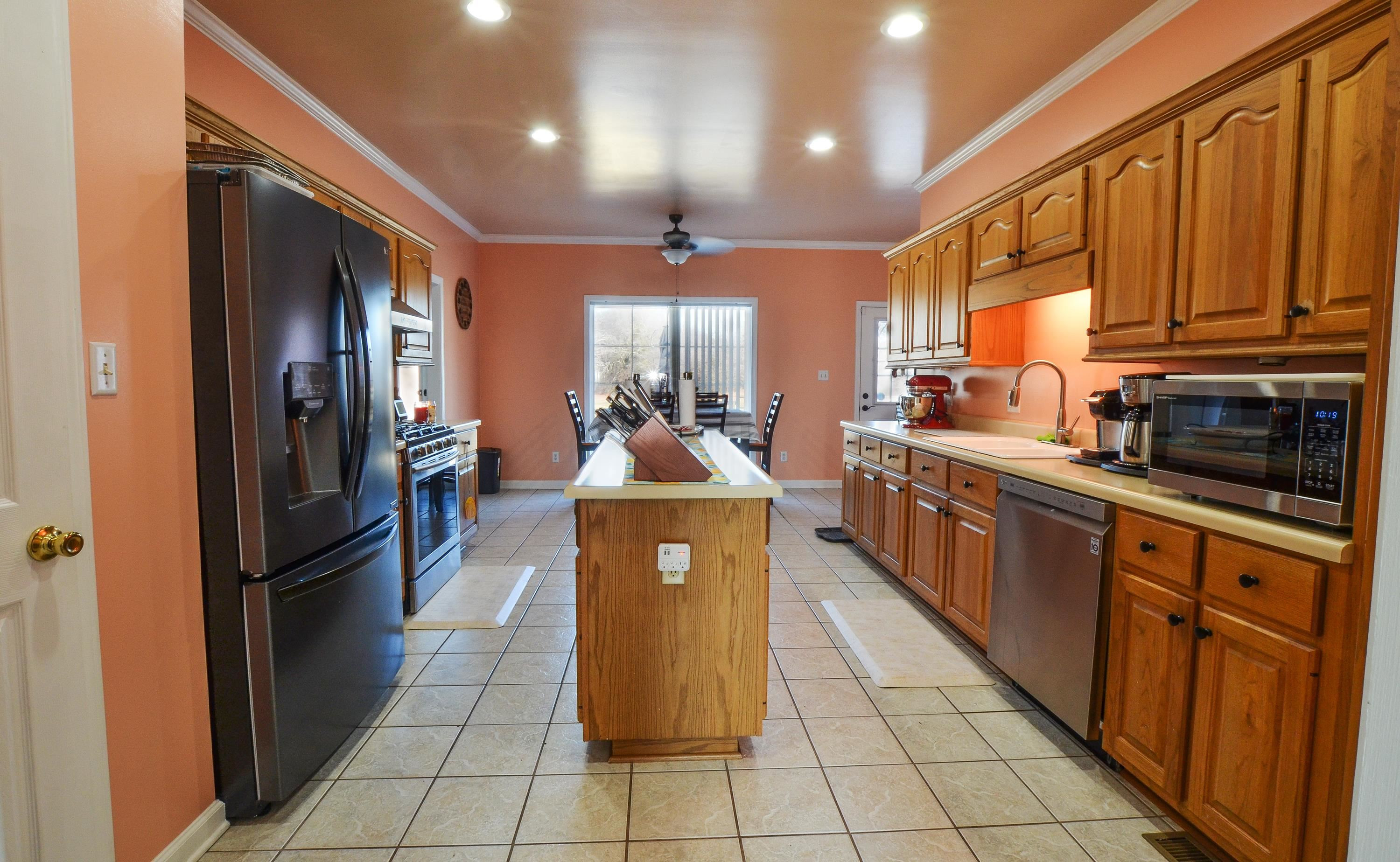 448 Plomar Williams Road Gadsden, TN 38337 - Photo 11 of 28 a kitchen with stainless steel appliances granite countertop a refrigerator a sink and dishwasher