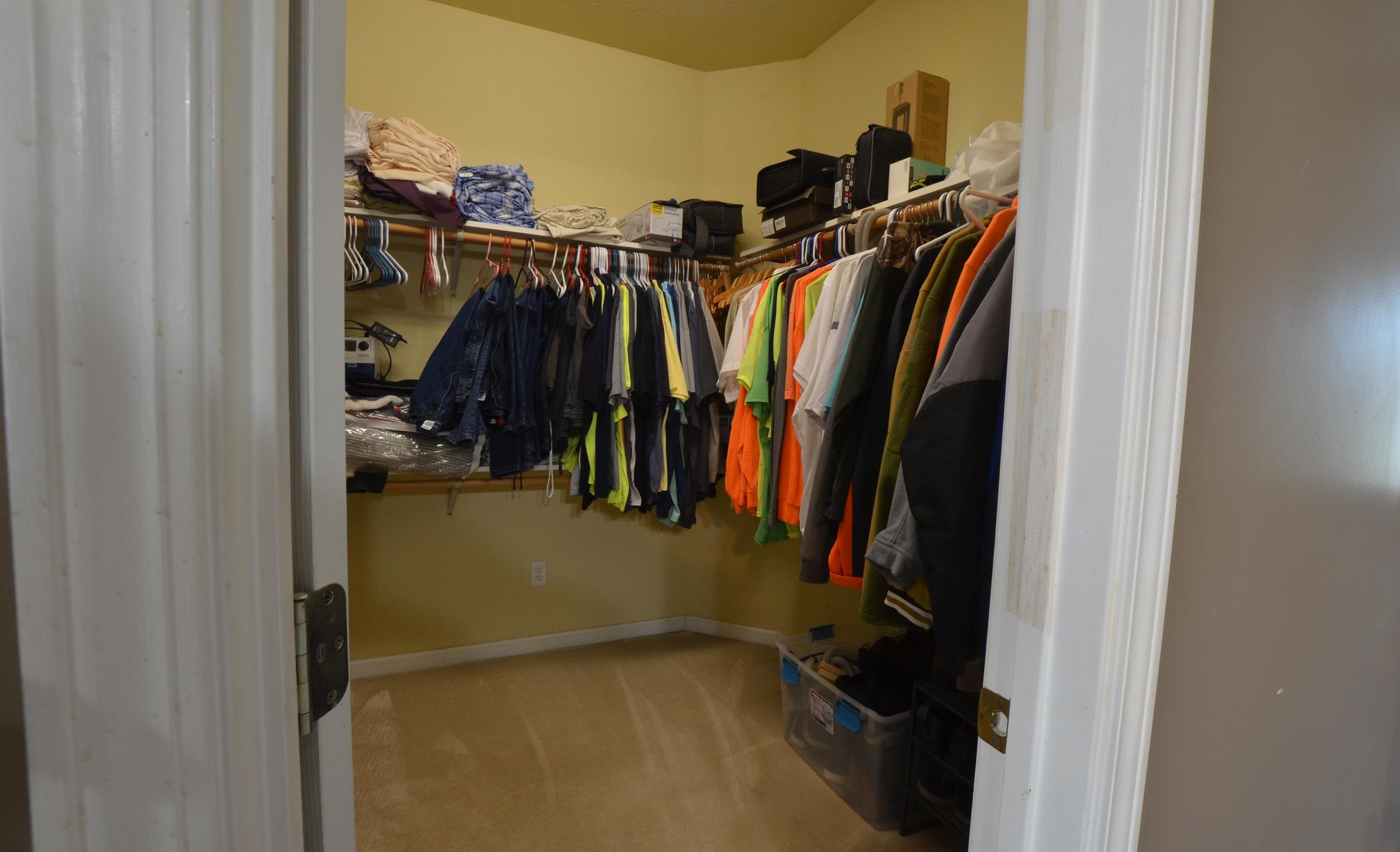 448 Plomar Williams Road Gadsden, TN 38337 - Photo 15 of 28 a view of walk in closet with clothes