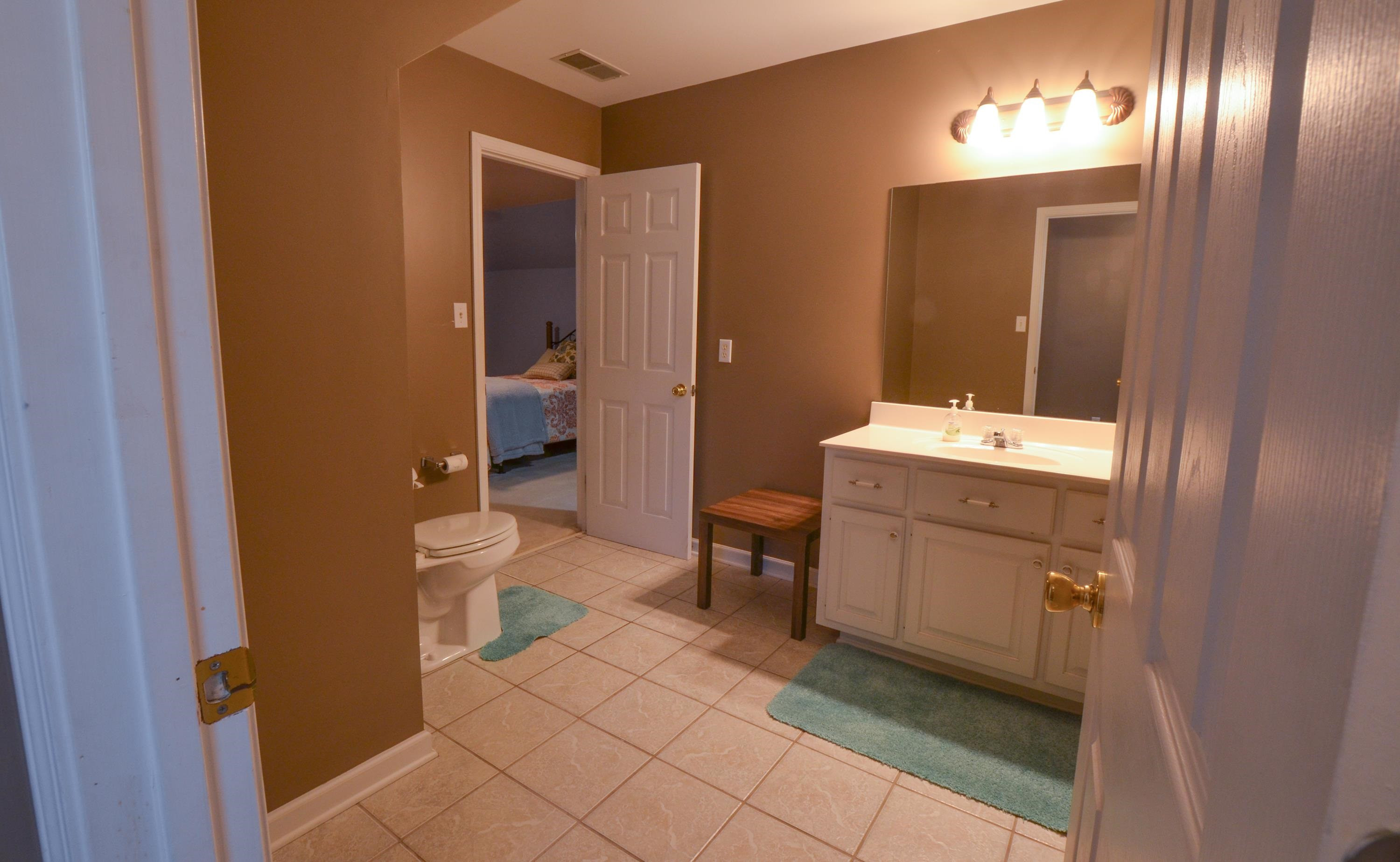 448 Plomar Williams Road Gadsden, TN 38337 - Photo 20 of 28 a bathroom with a sink a toilet and a mirror