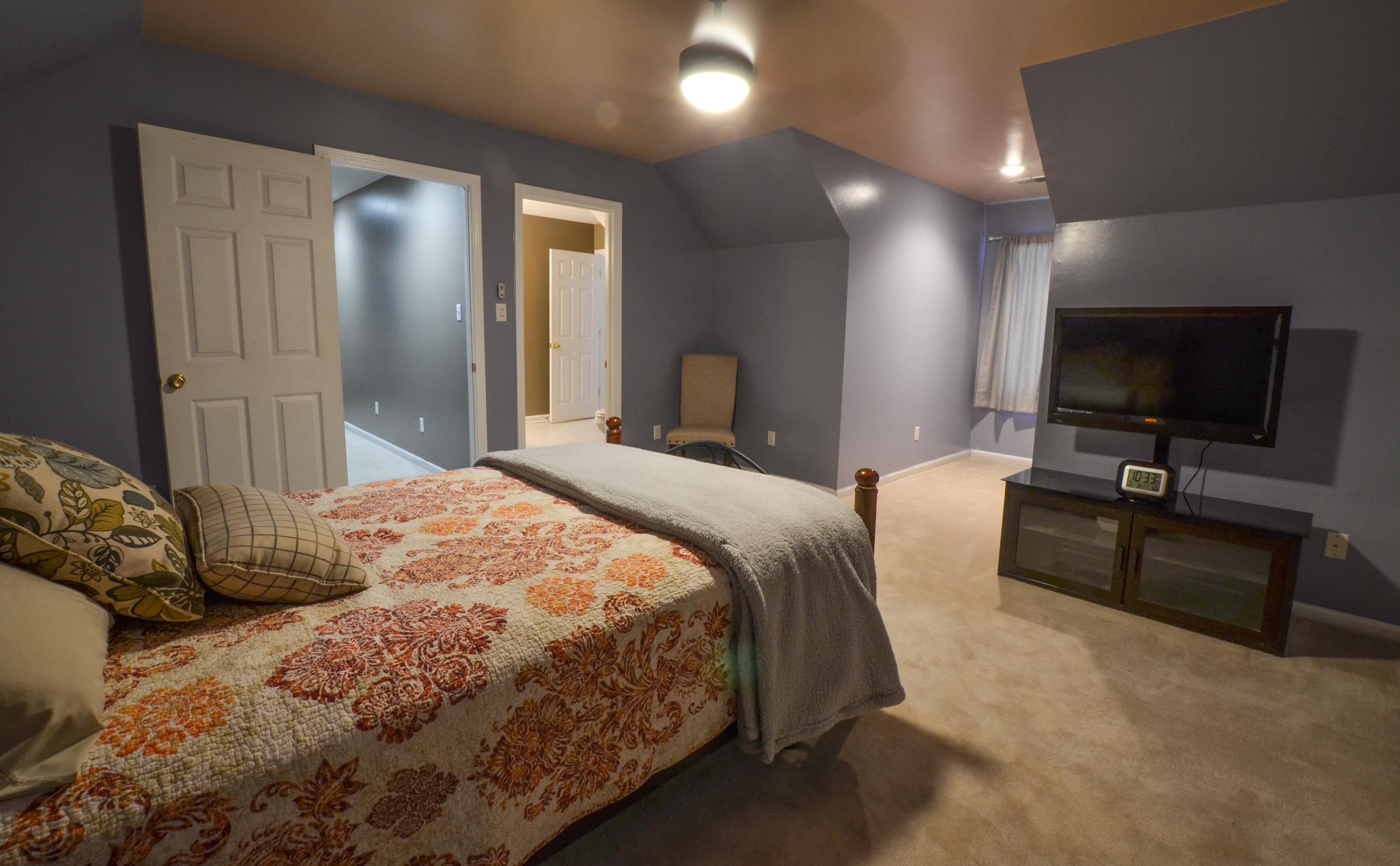 448 Plomar Williams Road Gadsden, TN 38337 - Photo 21 of 28 a bedroom with a bed and a flat screen tv