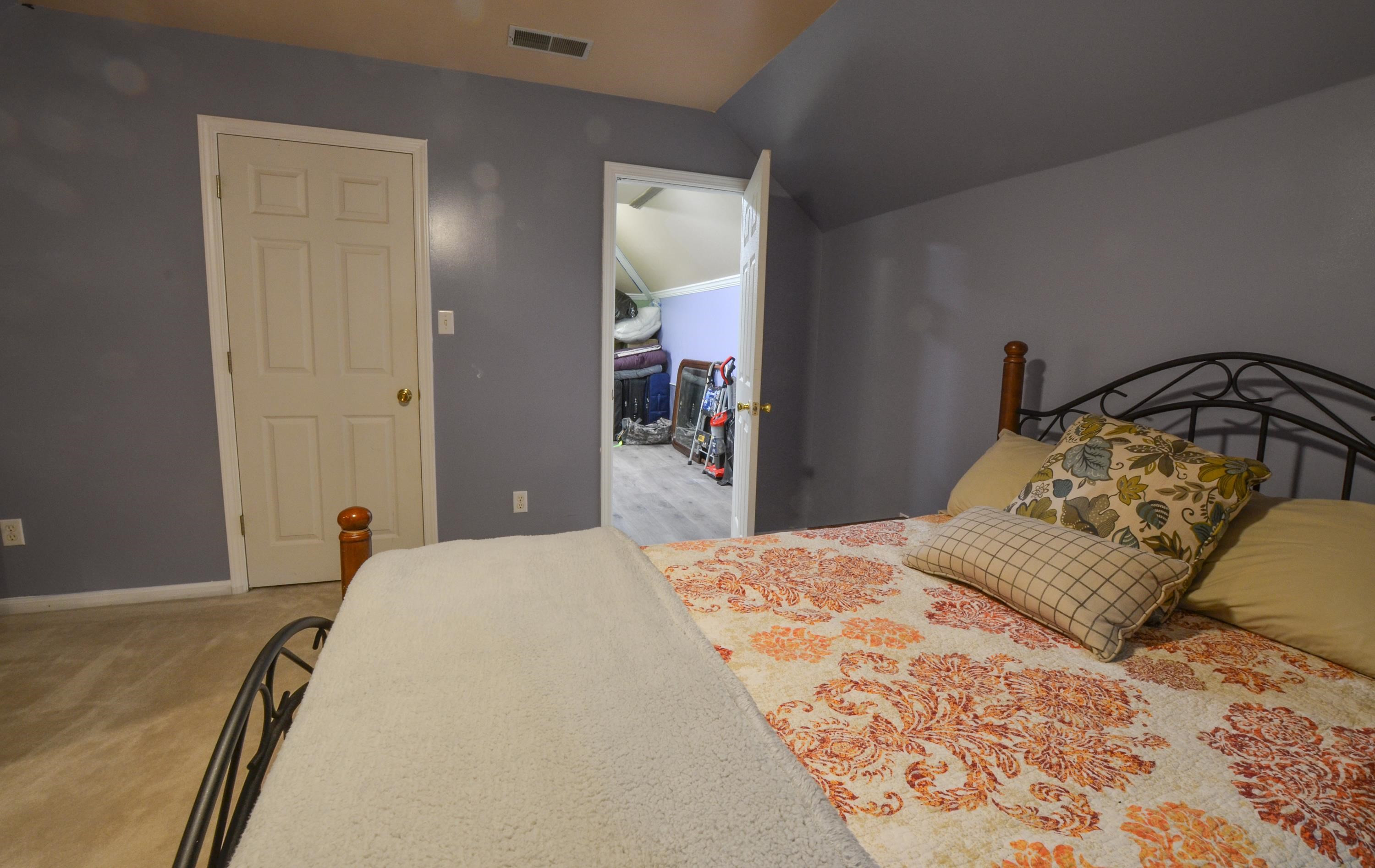 448 Plomar Williams Road Gadsden, TN 38337 - Photo 22 of 28 a bedroom with a bed and wooden floor