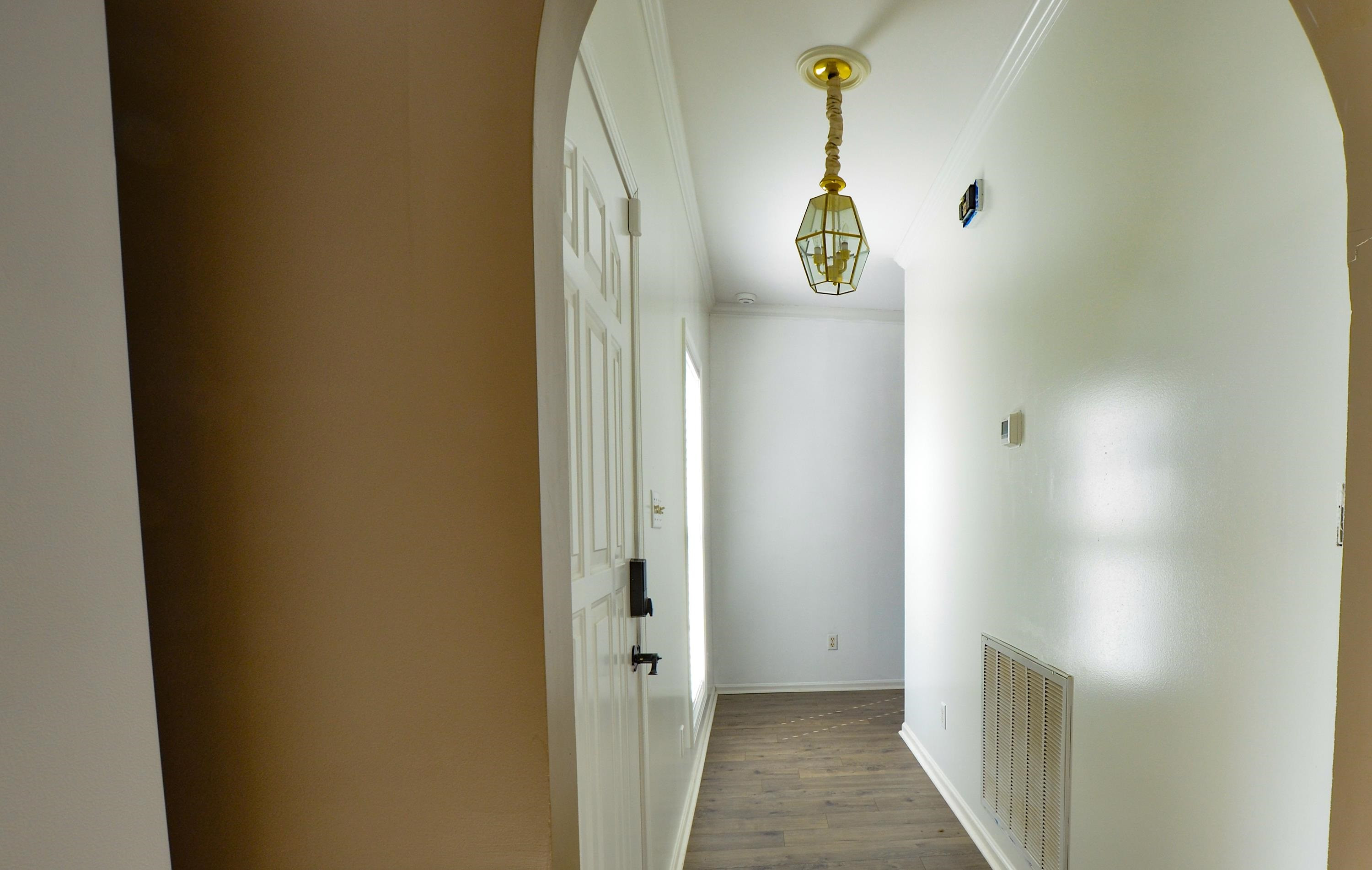 448 Plomar Williams Road Gadsden, TN 38337 - Photo 8 of 28 a view of a hallway with wooden floor and door