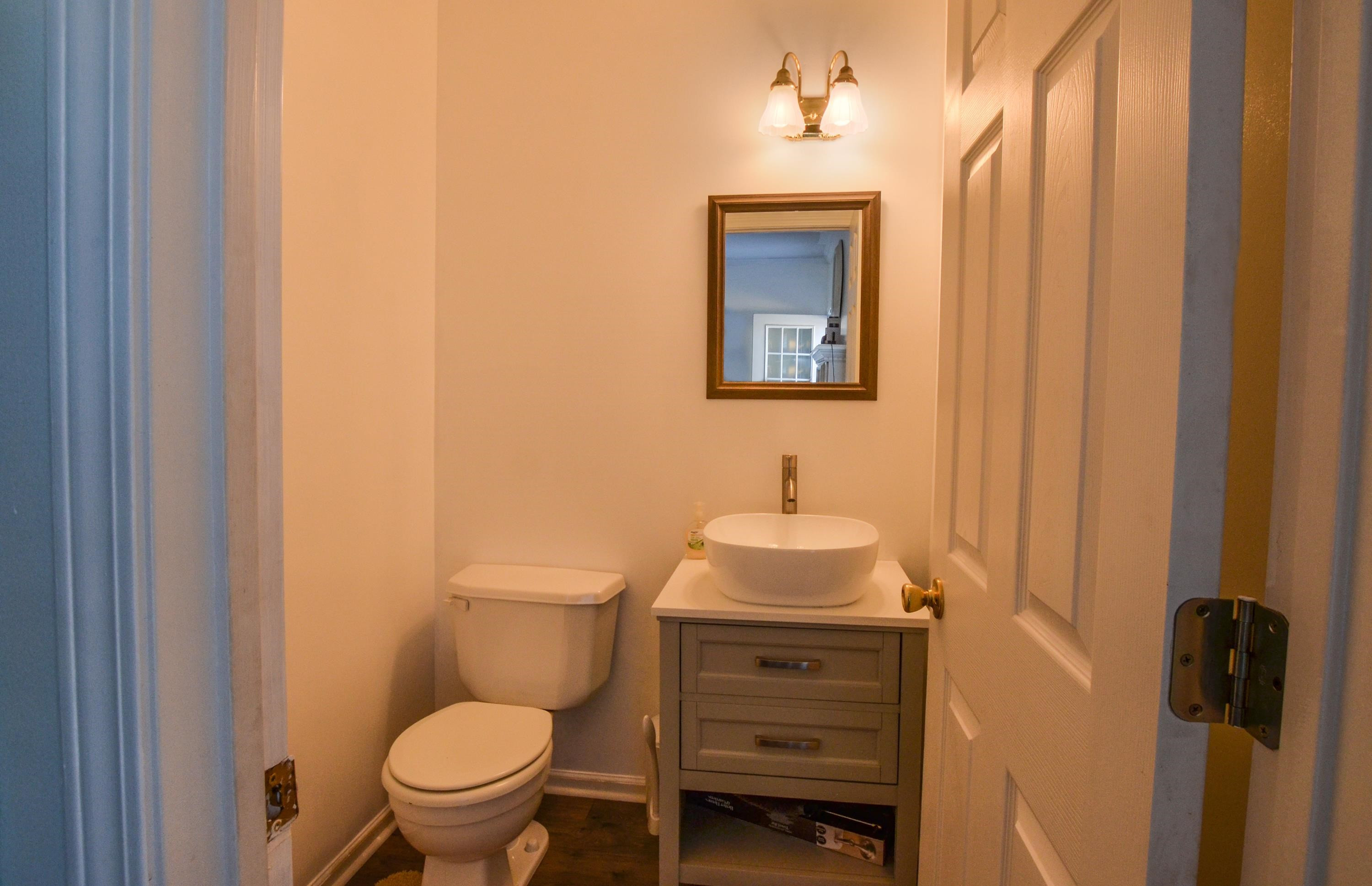 448 Plomar Williams Road Gadsden, TN 38337 - Photo 9 of 28 a bathroom with a toilet a sink and mirror