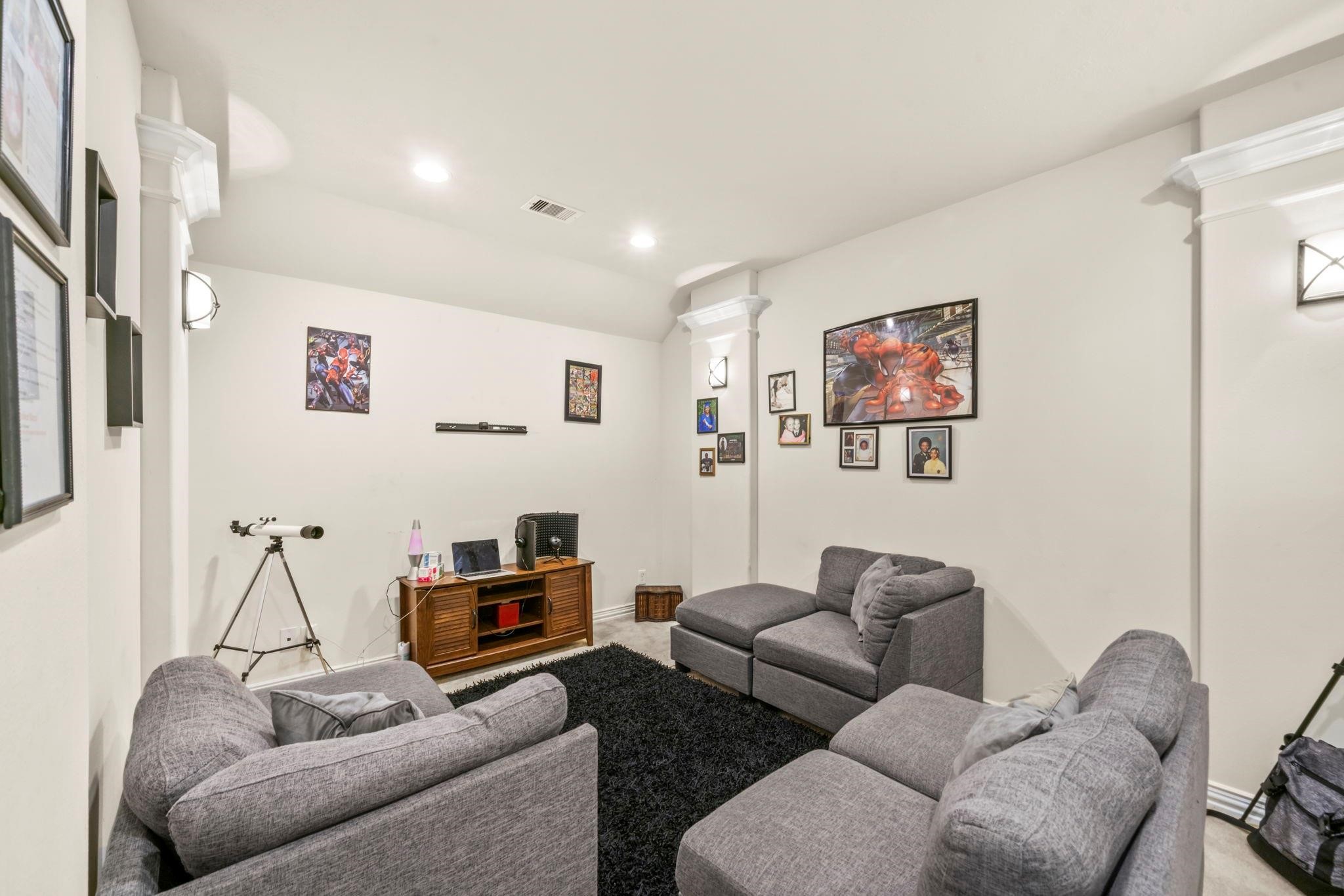 9939 Clear Diamond Drive Rosharon, TX 77583 - Photo 12 of 30 a living room with furniture and a flat screen tv