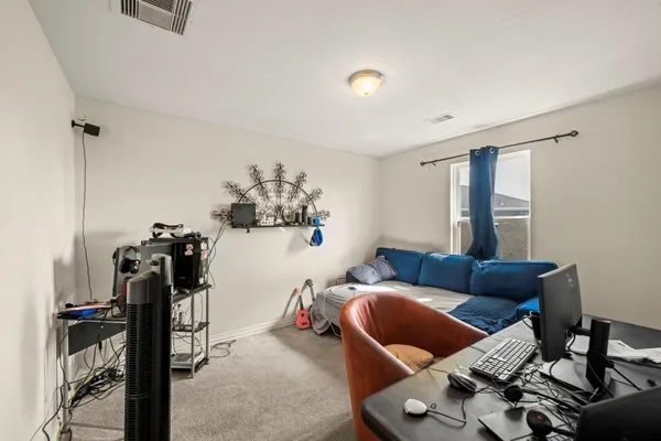 a bed room with a bed and a chandelier